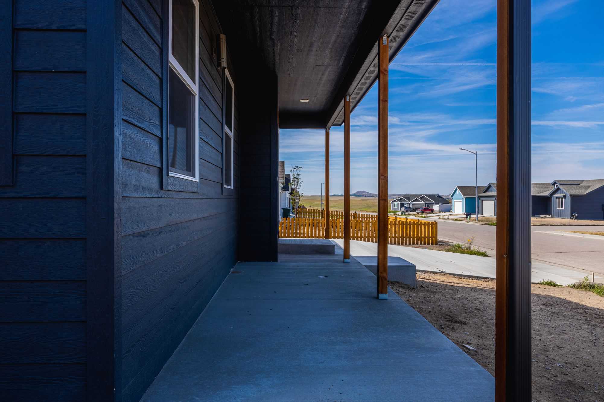 front porch with grey cement