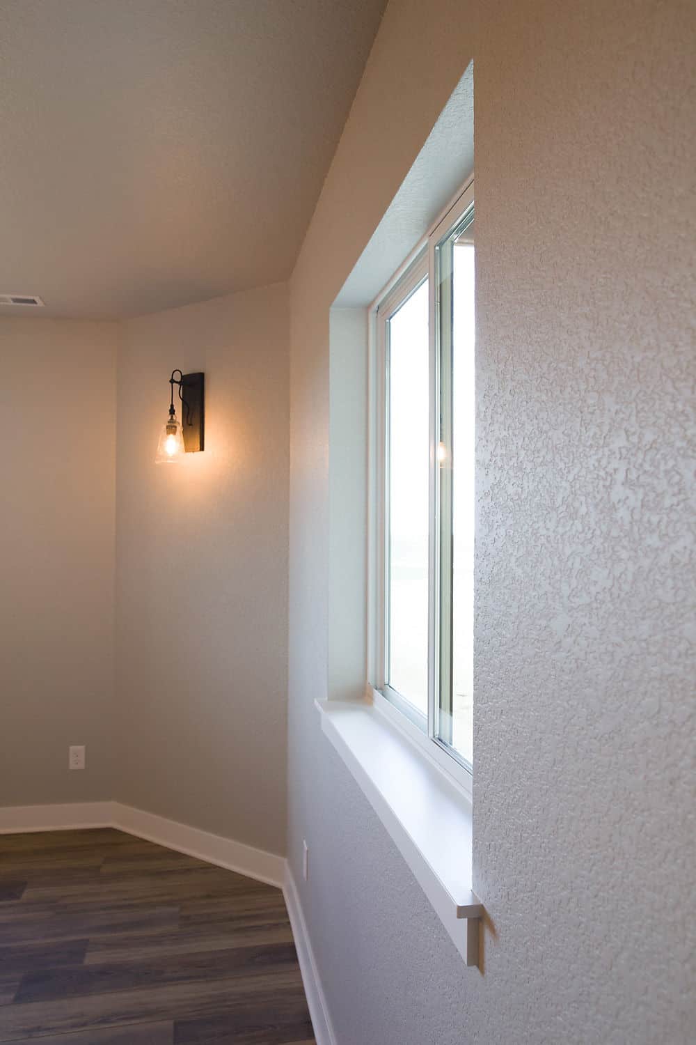 White wall and sconce